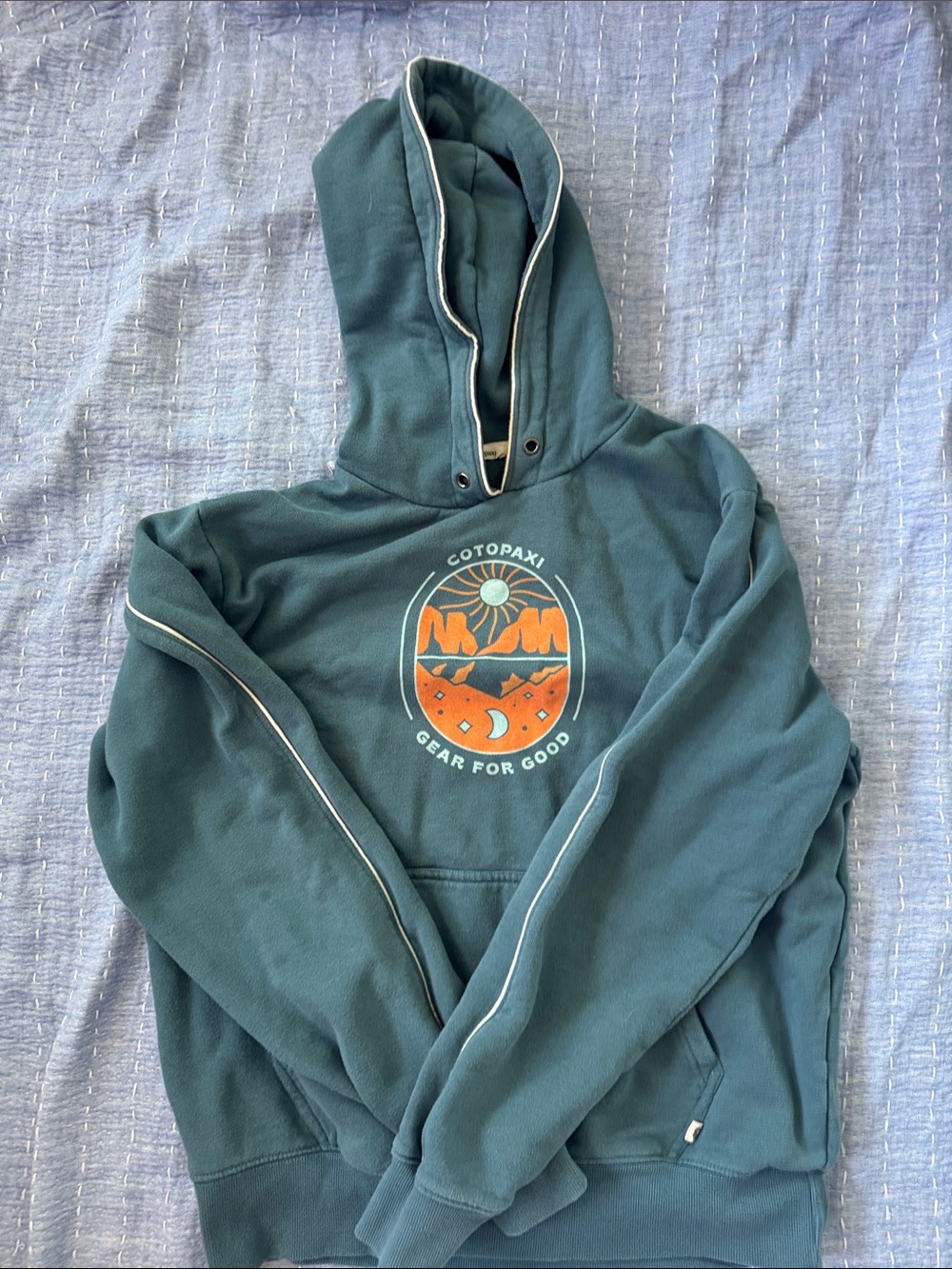 cotopaxi teal green pullover hoodie with orange graphic